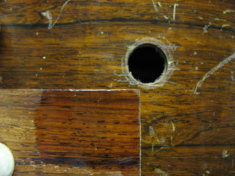 Repair hole on rosewood side 4