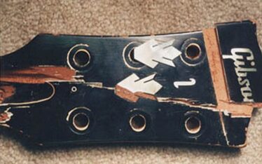 Broken headstock with broken Gibson logo