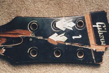 Broken headstock with broken Gibson logo