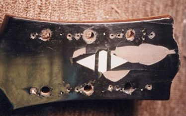 Damaged headstock of Vintage Gibson Super 400 Archtop guitar