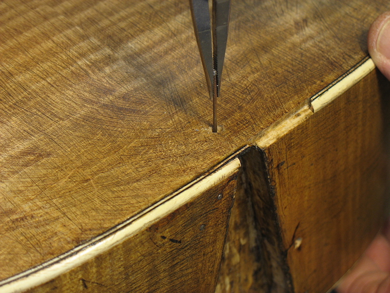 Removing the rusty nail from the archtop guitar body