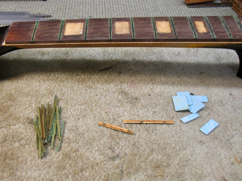 Frets, bindings, and inlays on the Gretsch fingerboard were removed to replace