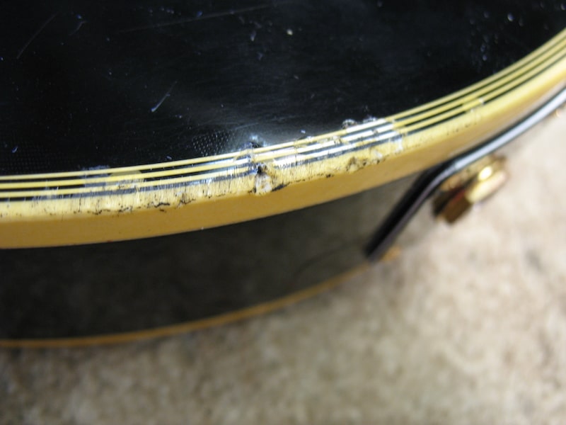 Damaged binding and dented top