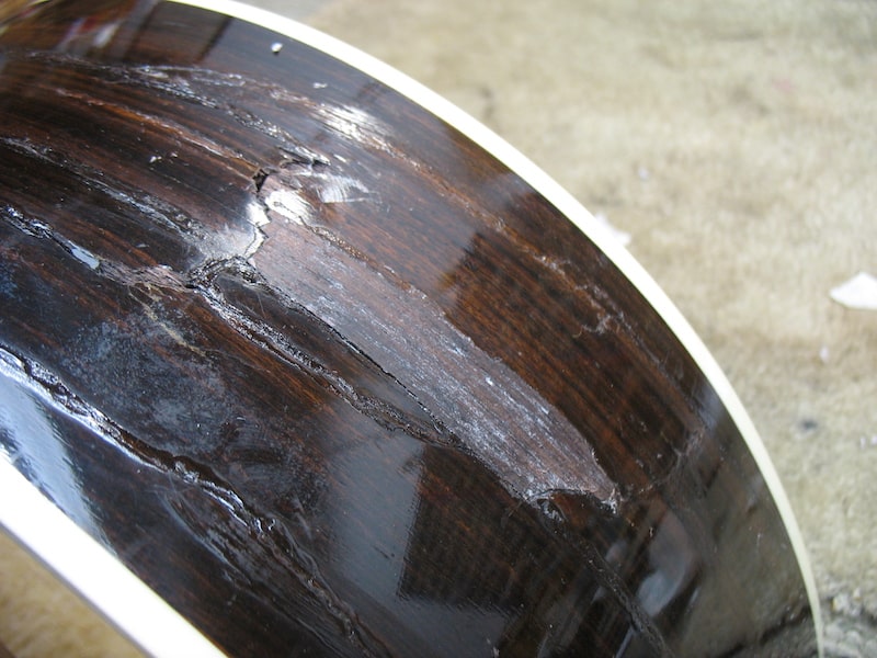 The glued rosewood side with the missing part